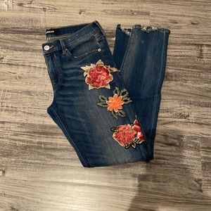 Express distressed denim with sequence floral